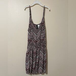 Pink and black tribal print H&M romper with adjustable straps.